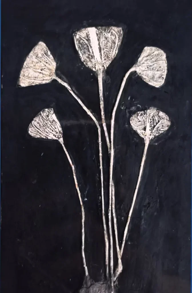 Crinoid fossil with five distinct calyxes on stems
