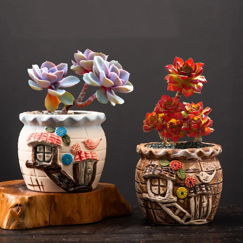 Two fairy tale house ceramic planters with dimensions displayed