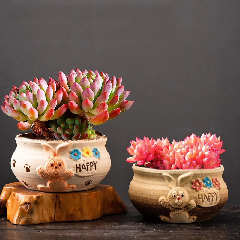 Two bunny design ceramic planters with dimensions displayed