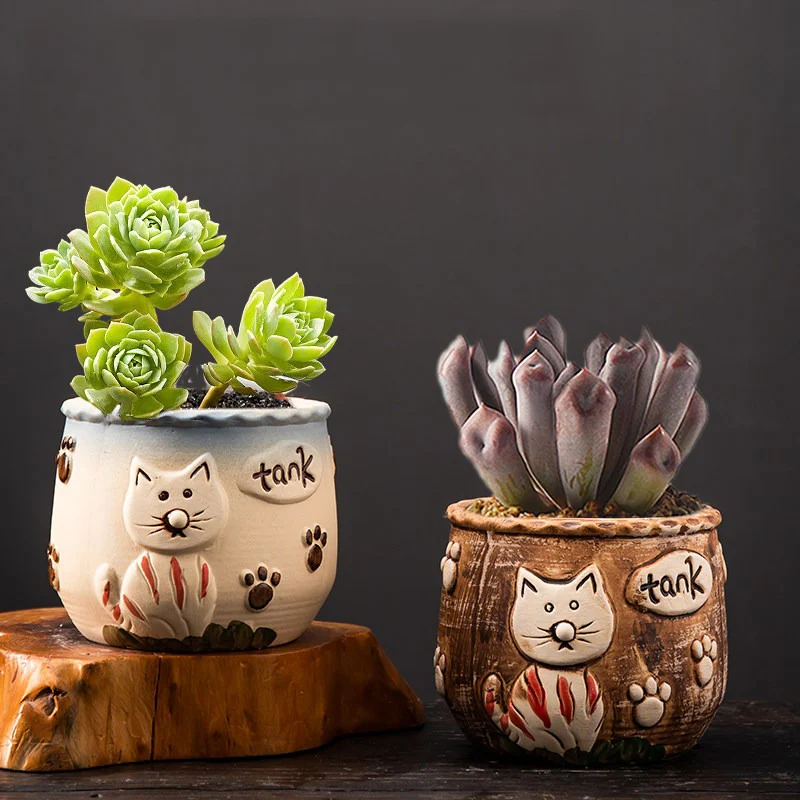 Two cat design ceramic planters with tank text and dimensions displayed