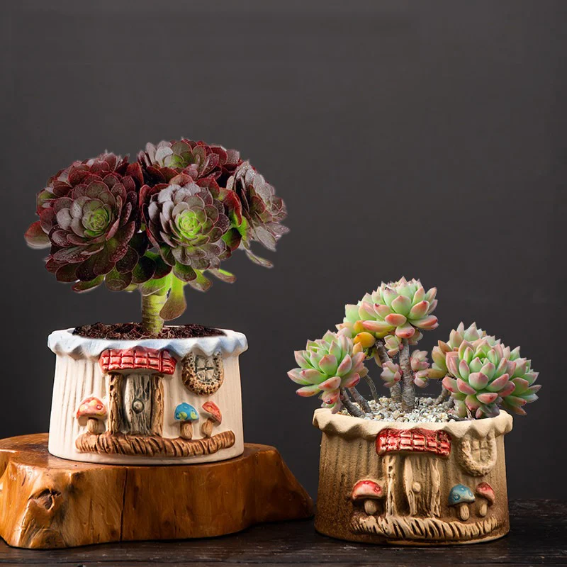 Two mushroom house ceramic planters with dimensions displayed