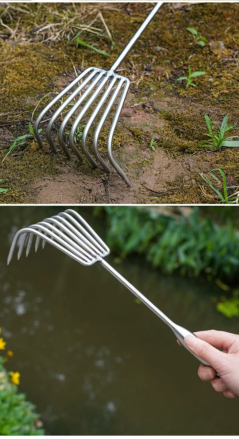 Stainless steel rake loosening soil and held over a pond